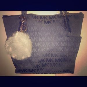 Authentic Michael Kors purse. Lightly worn.MK LOGO